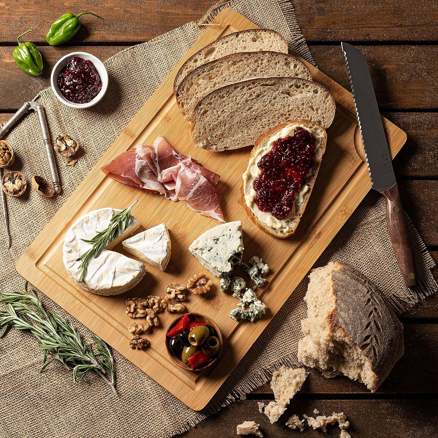 Gourmanitys bamboo cutting board has two sides, one perfect as a serving platter or charcuterie board